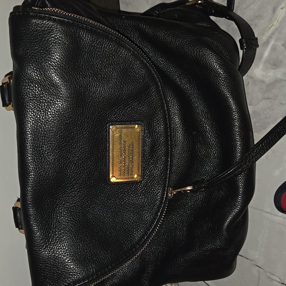Marc Jacob’s Black Peddled Leather Backpack.